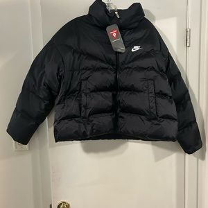 Woman nike Black Shine jacket Nike sign is white New with tag Size Large